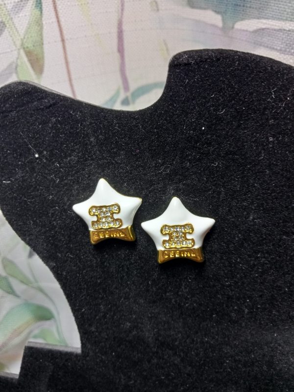 Pendientes estrella dorada y blanca Celine - Imagen 3