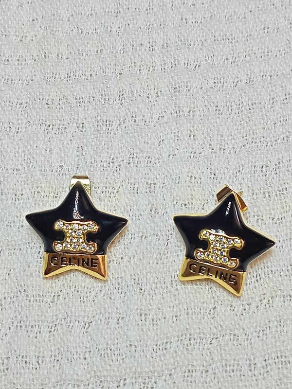 Pendientes negros y dorados estrella Celine