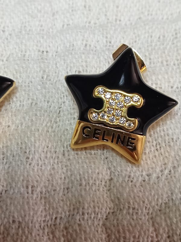 Pendientes negros y dorados estrella Celine - Imagen 3